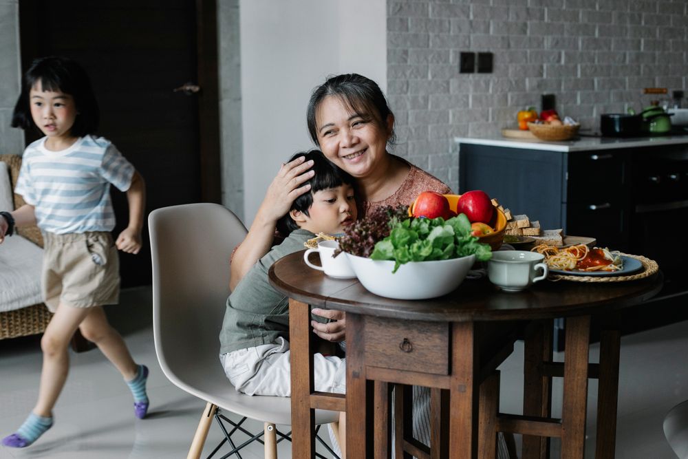 A grandmother and grandchild together at the breakfast table